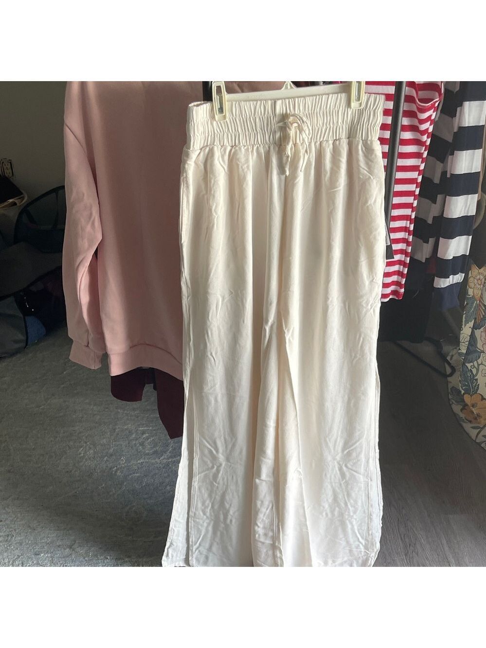 Women's Wide Leg Cream Pants. New with tag. With slits up the legs and pockets